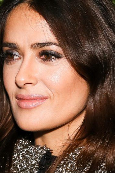close up shot of Salma Hayek with brown wavy hair, on the red carpet