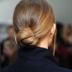 back view of blonde hair in low knotted bun
