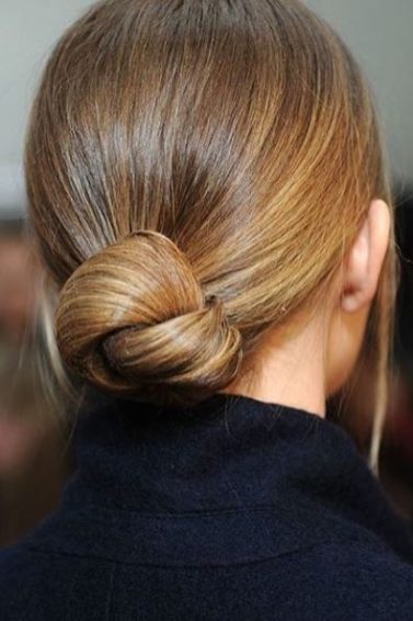 back view of blonde hair in low knotted bun