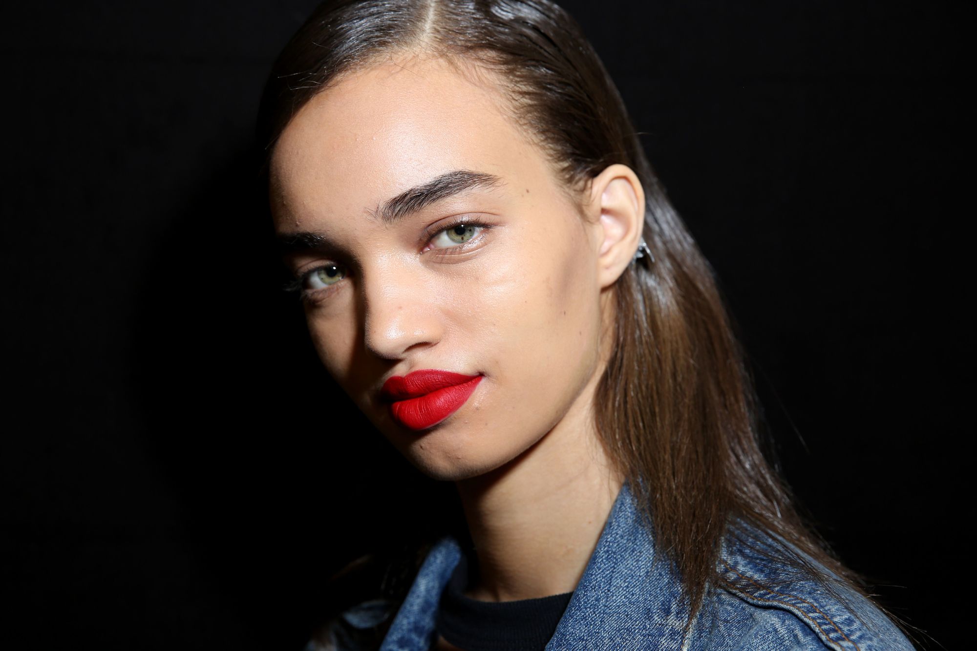the best flat iron for natural hair: close up shot of model with straightened natural hair at the blumarine show
