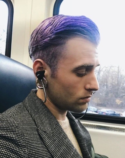 Pantone Colour of the Year 2018: photo of a man on a train with a purple undercut hairstyle