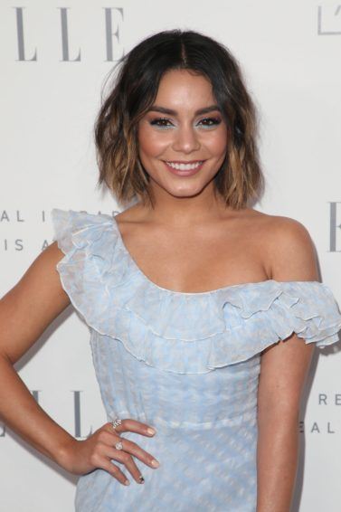 close up shot of vanessa hudgens with wavy ombre bob wearing blue dress on the elle style awards red carpet