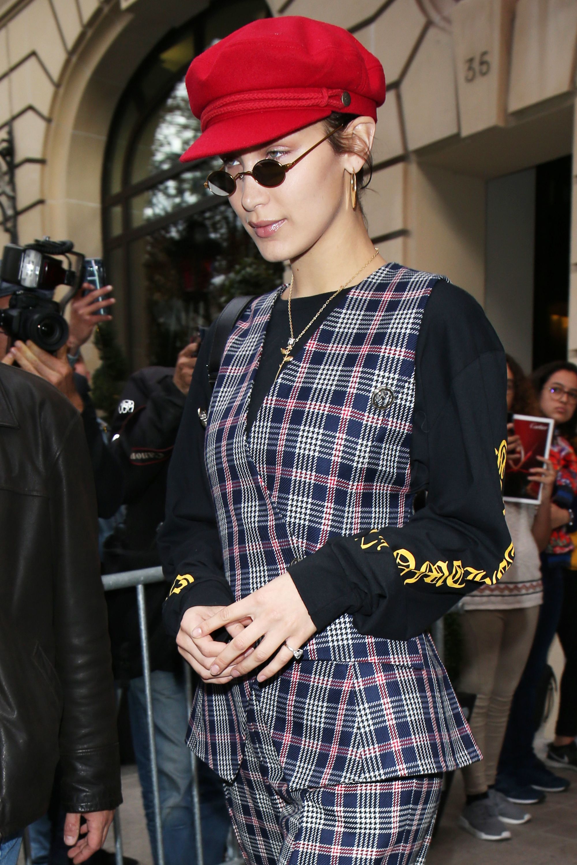 bella hadid baker boy hat and micro sunglasses trend