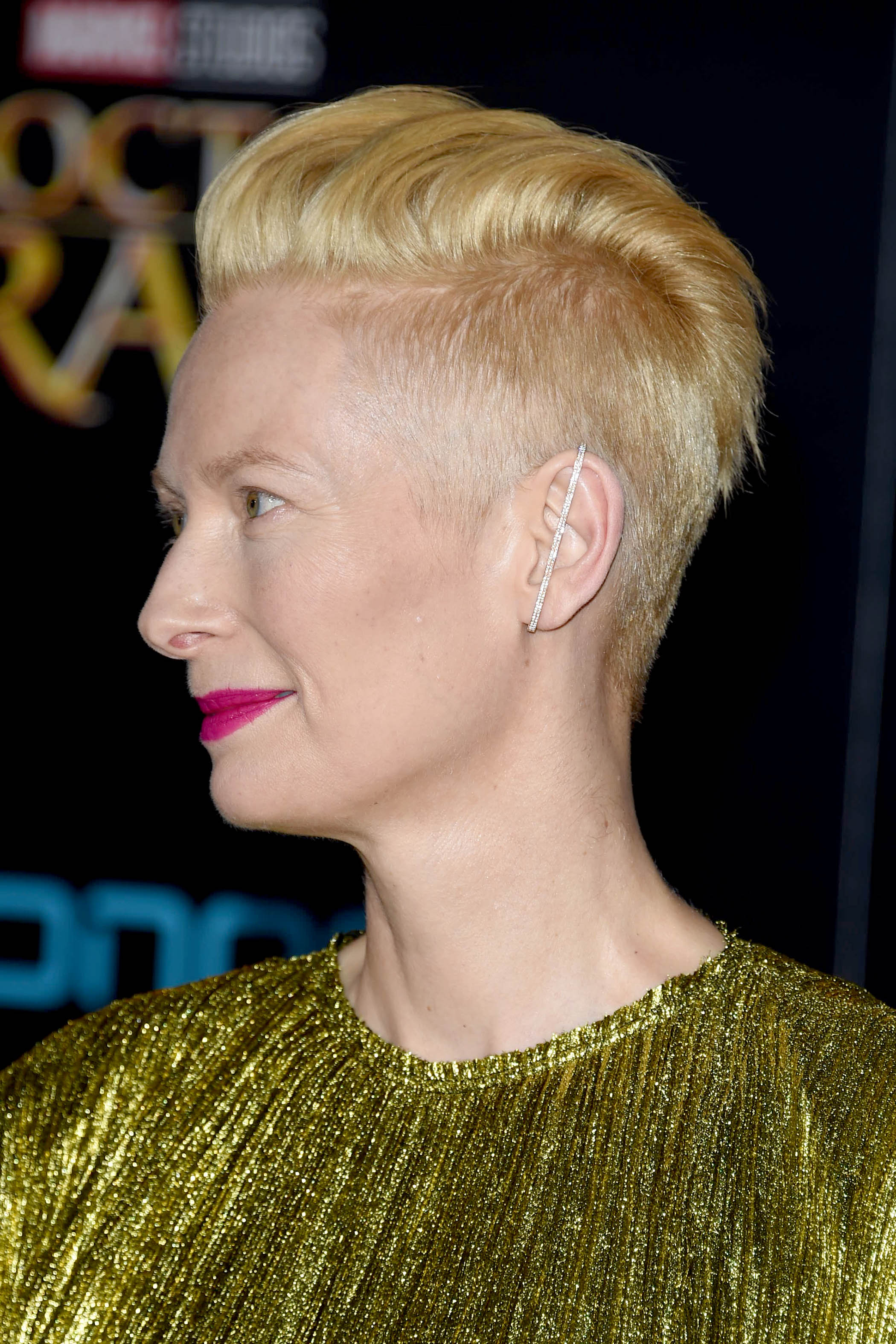 side view of tilda swinton with blonde undercut pixie