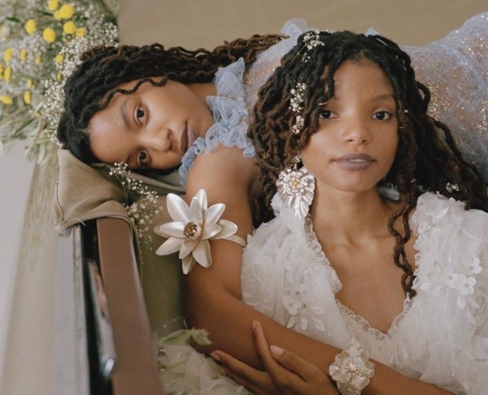 close up shot of chloe and halle, wearing natural hairstyles and posing for rodarte campaign