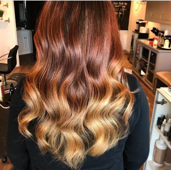back view of long copper blonde ombre wavy hair