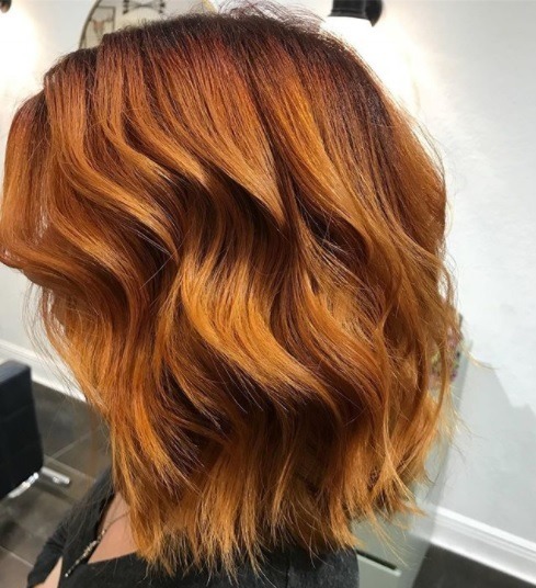 side profile shoulder length curly copper hair