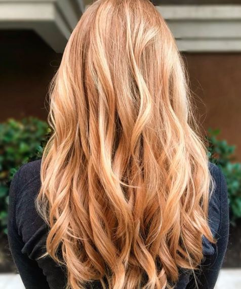 back view of woman with light copper blonde hair