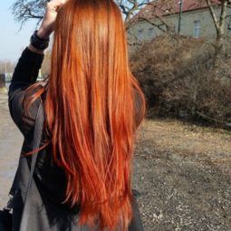 back view of a woman with really long ginger hair