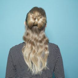 Hair bow blonde girl with back to camera