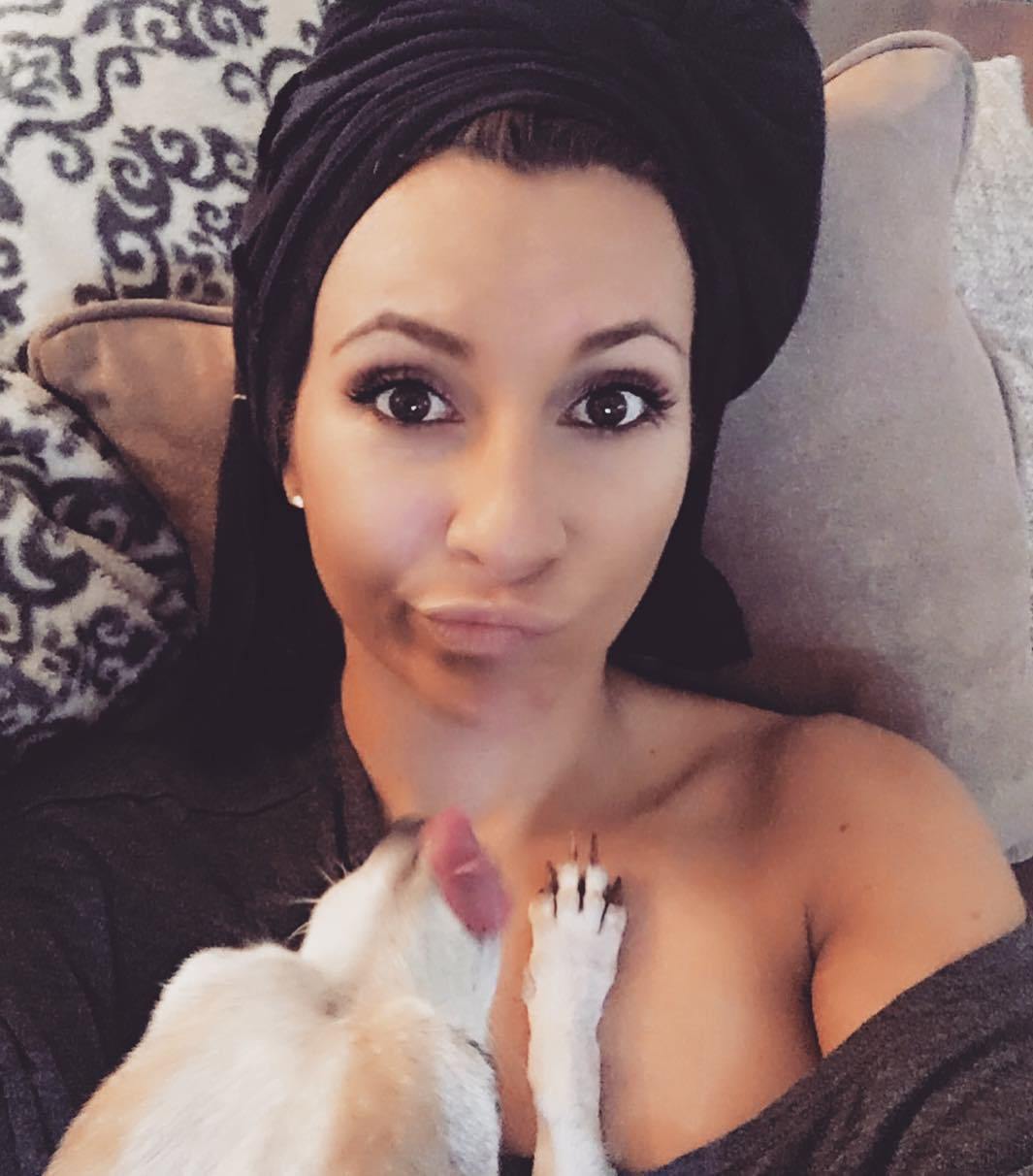 Hair plopping girl with t-shirt on her head taking a selfie