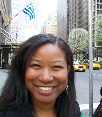 Jeanette Nkwate Chief Content Officer ATH UK wearing a beanie with straight hair