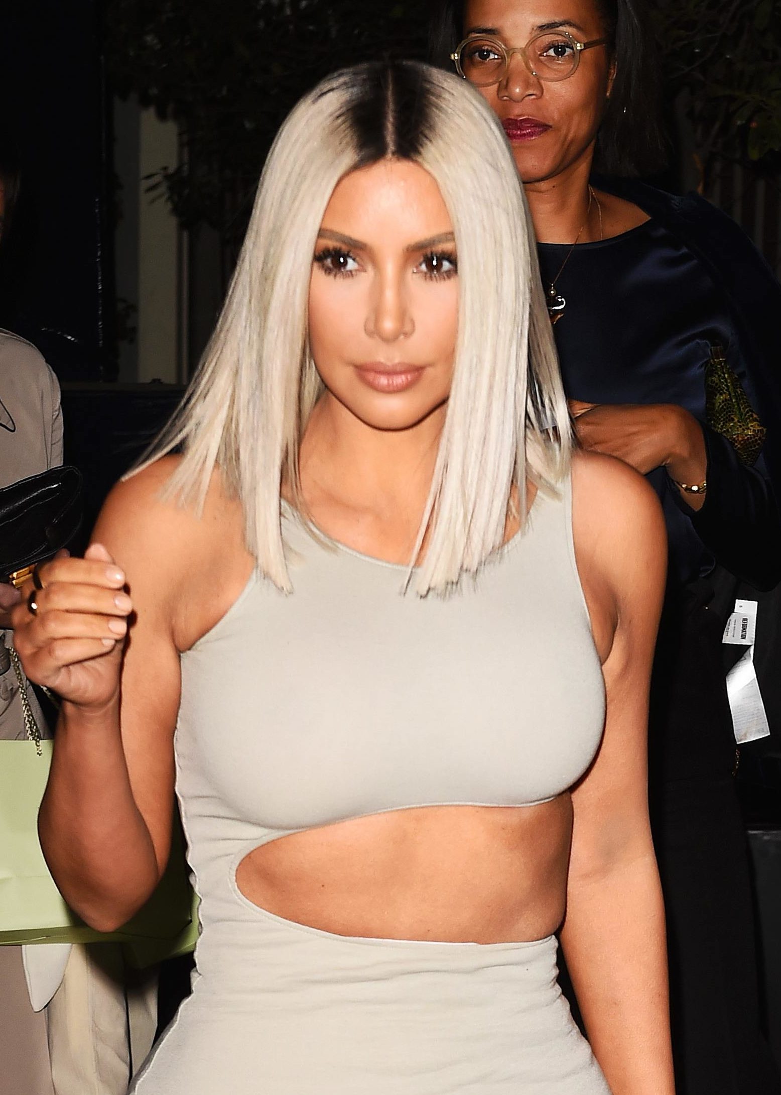 Kim Kardashian with a silver bob and dark grown out roots