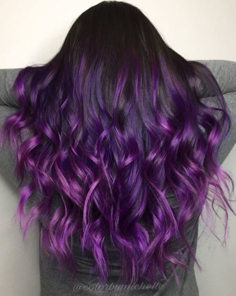 back view of woman with long purple ombre hair