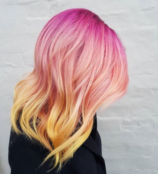 side view of pink and yellow ombre hair
