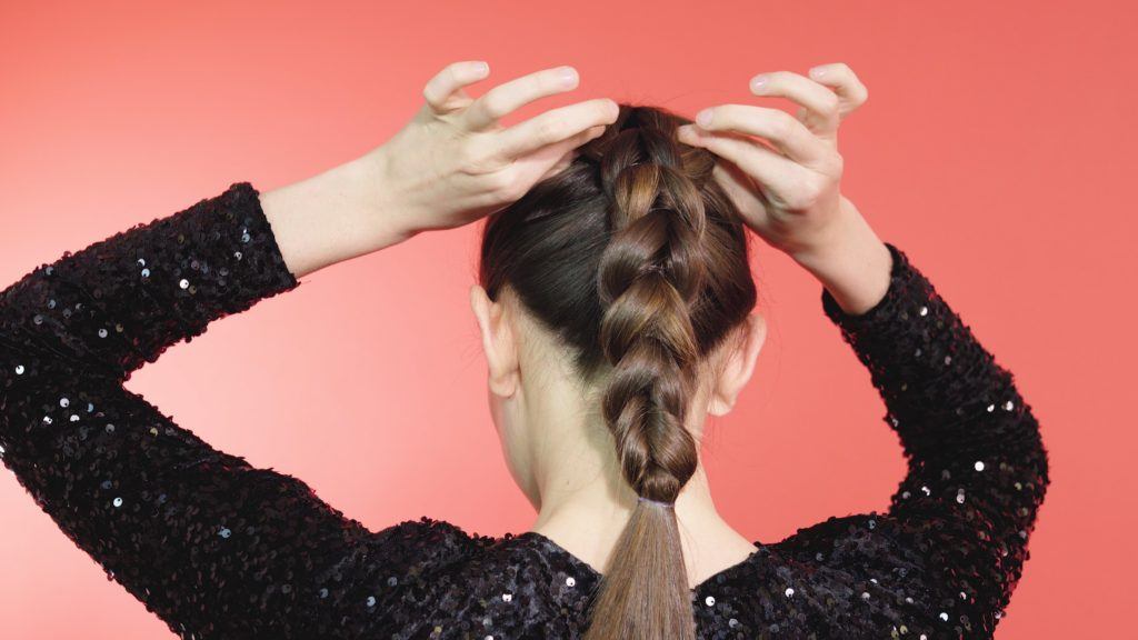 Brunette girl pancaking a pull-through braid