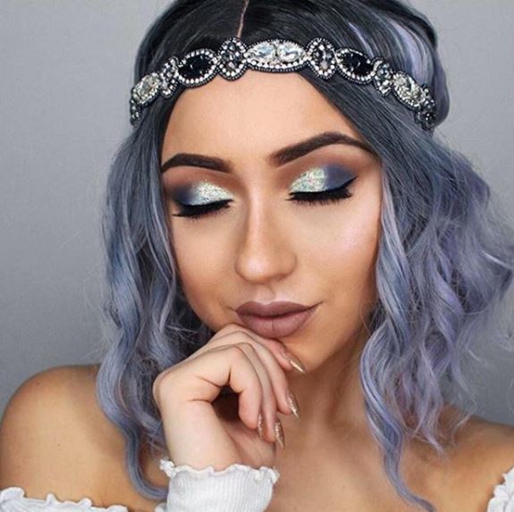 woman with purple pastel wavy ombre hair