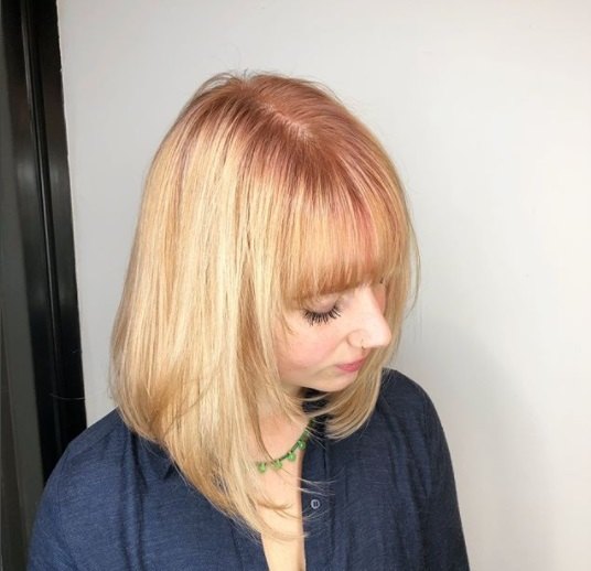 shot from above of a woman with rose gold shadow roots hair