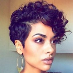 woman with medium brown curly pixie hair