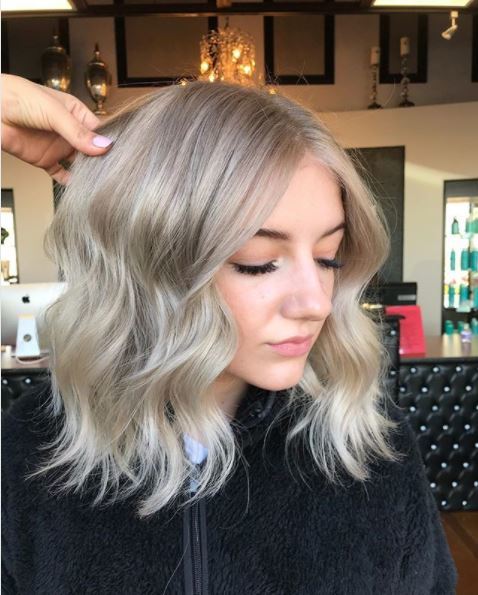 woman with blonde ombre hair on shoulder length hair