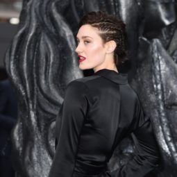 close up shot of tess haubirch with long pixie hairstyle with side braids in it, wearing all black on the red carpet
