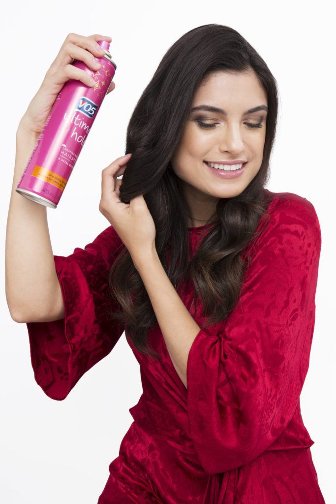 Sock curls tutorial brunette girl with curls using hairspray