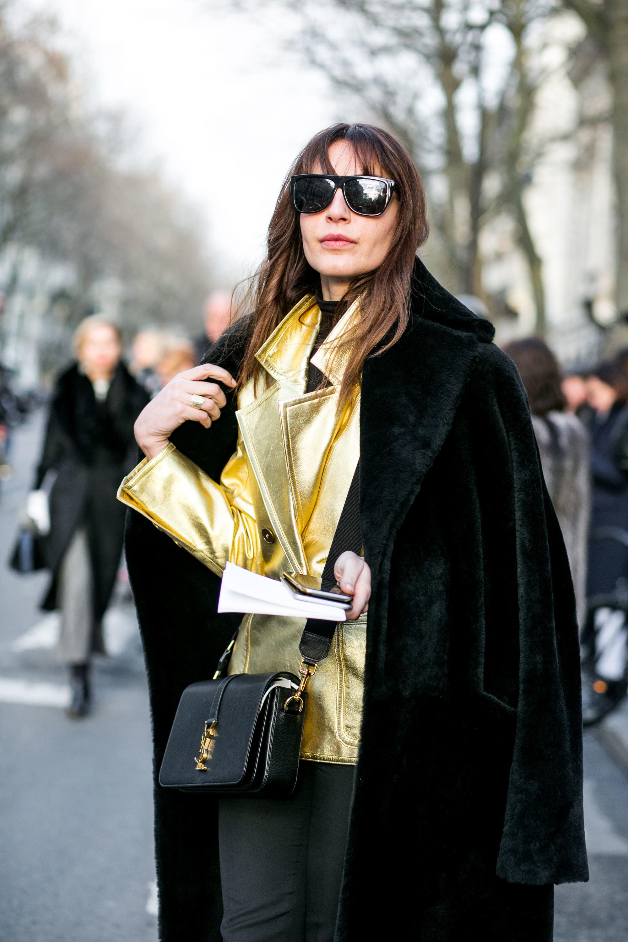 brunette street style model at pfw with birkin bangs