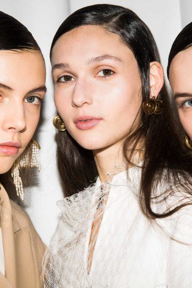 Why is my hair so oily three models backstage at Ellery show
