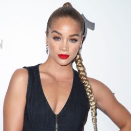 Sexy hairstyles for long hair: Jasmine Sanders with golden blonde hair in a long braid, wearing red lipstick