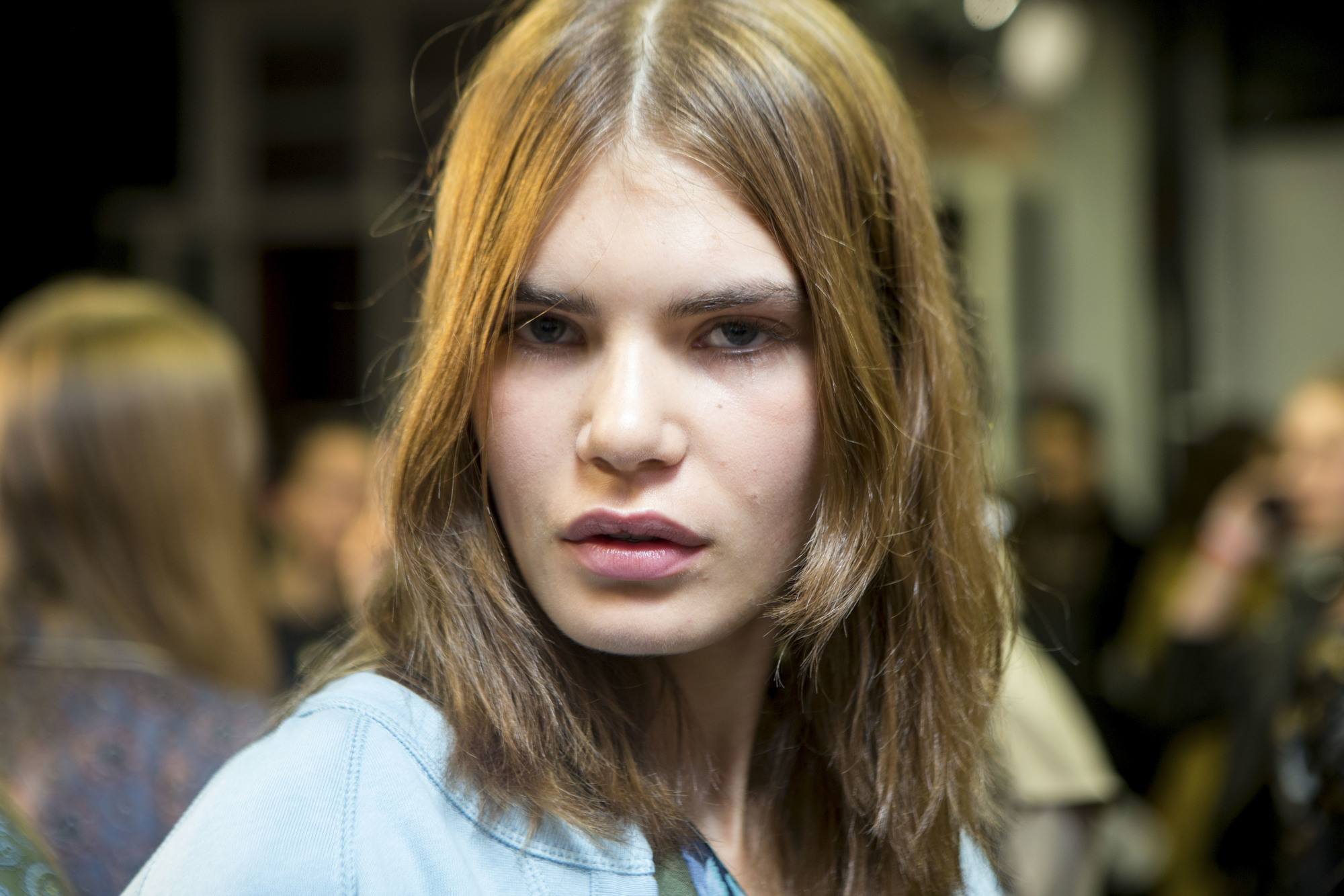 brunette model with shoulder length layered hair