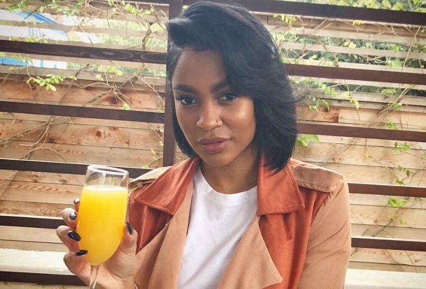 close up shot of woman with layered bob hairstyle, posing outside