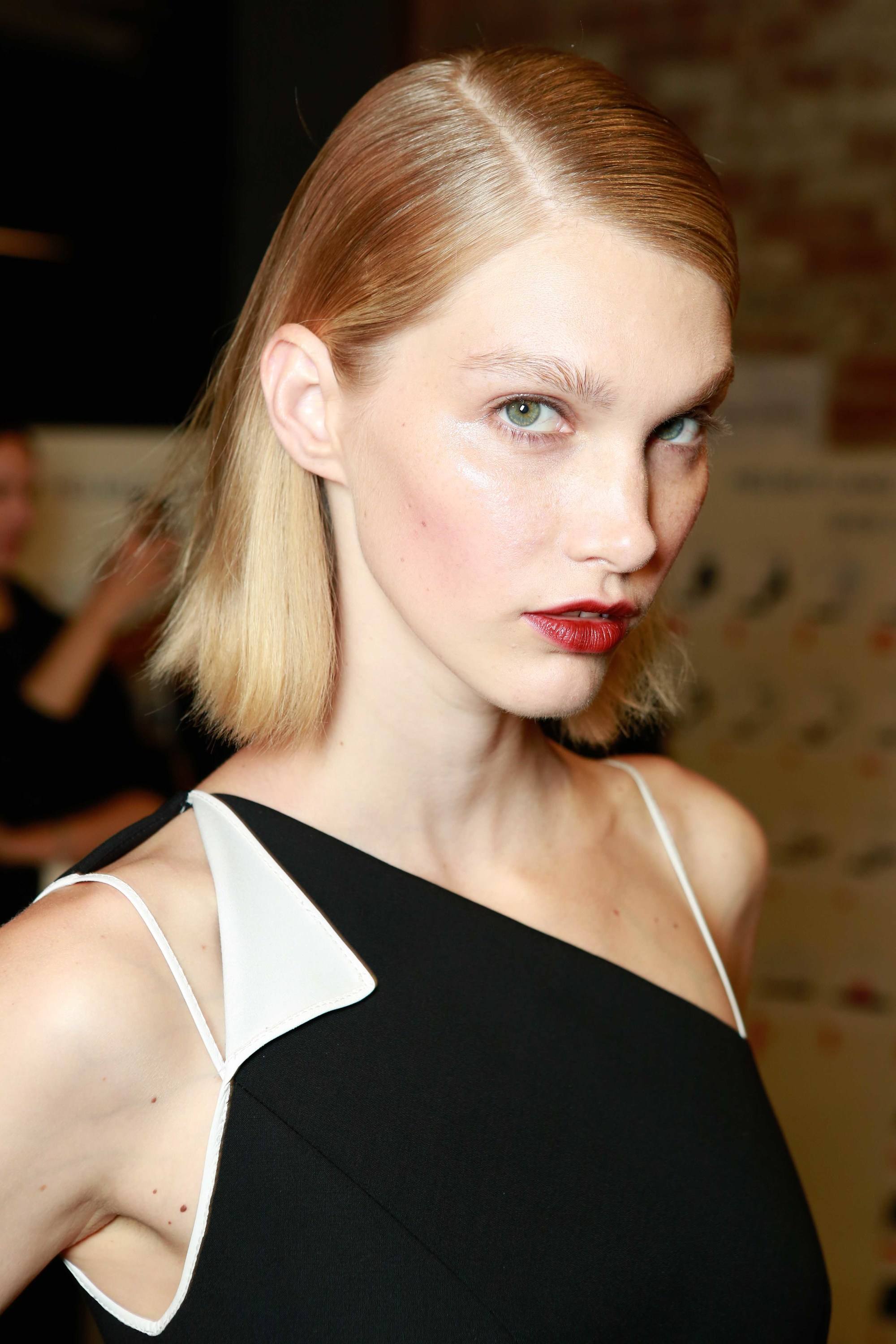 Why is my hair so oily blonde woman with short hair