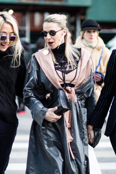 Three blonde women at fashion week walking outside