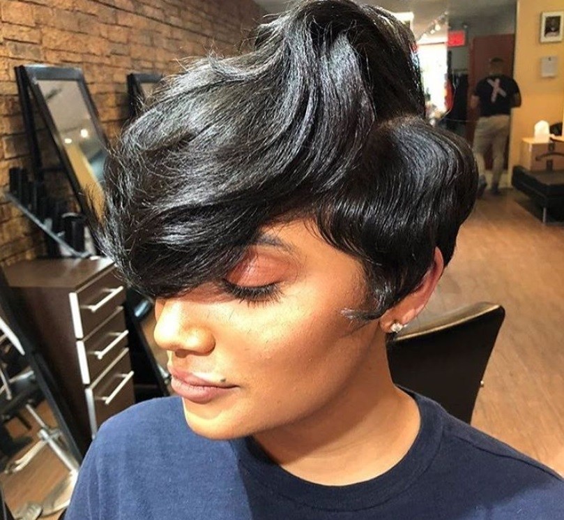 close up shot of woman with long pixie hairstyle, posing in a salon