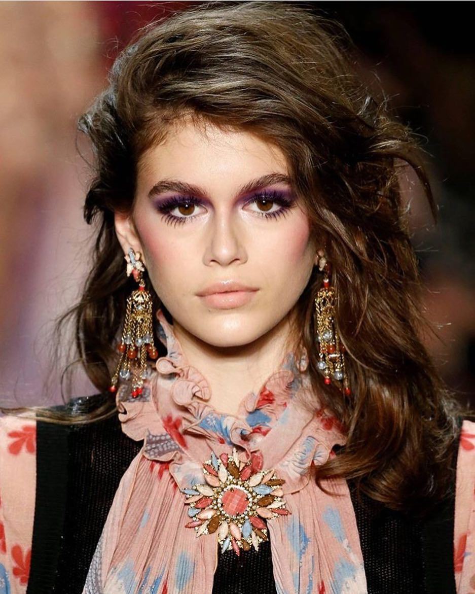 Kaia Gerber on the runway with thick hair
