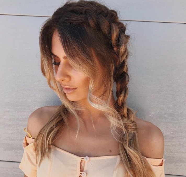 textured hairstyles: close up shot of woman with textured twisted pigtails hairstyle