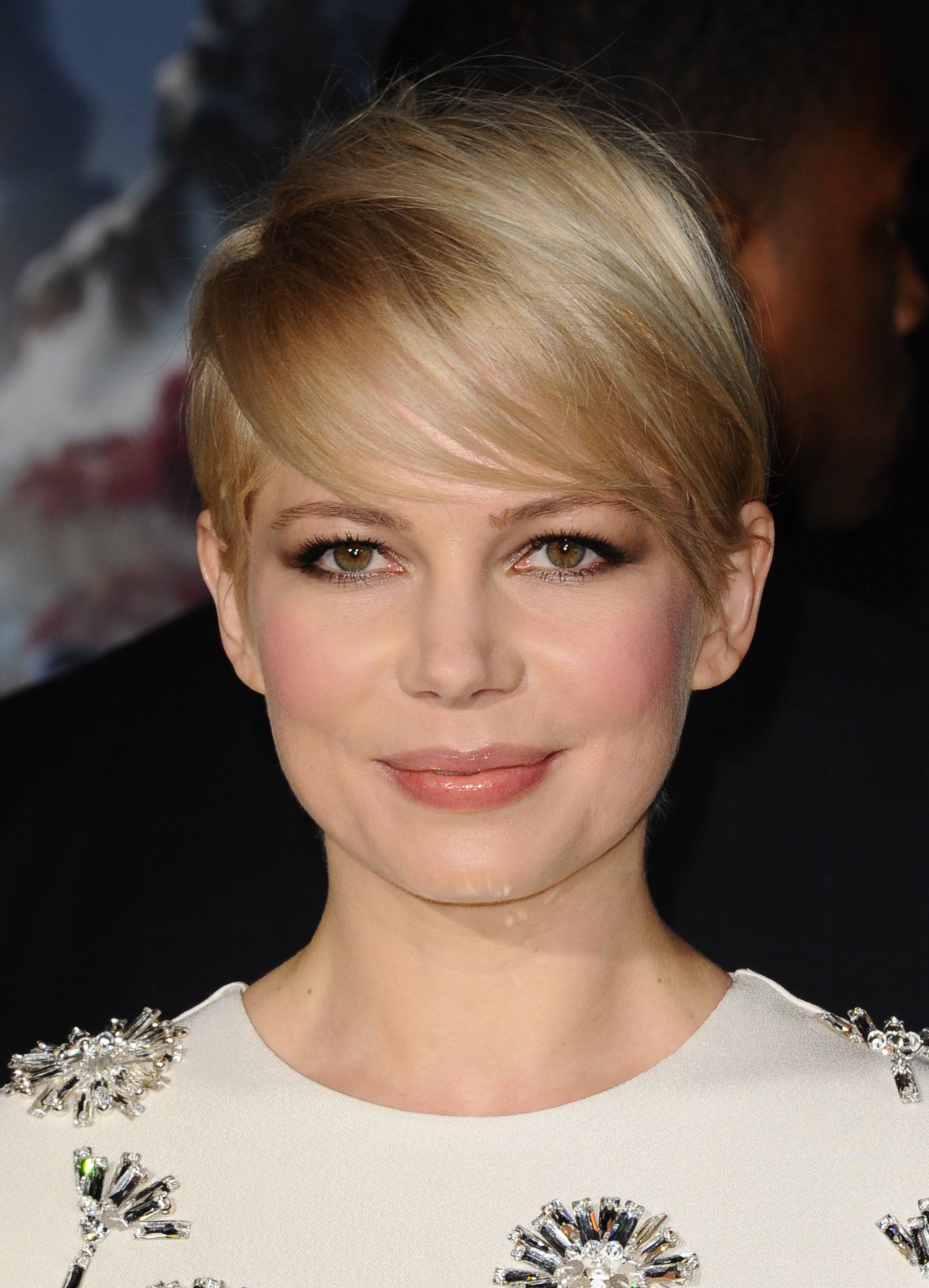Pixie cut with bangs: Michelle Williams with a blonde sweeping classic pixie cut