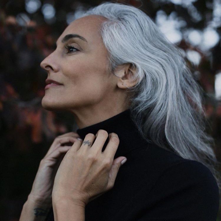 What causes grey hair woman with white hair
