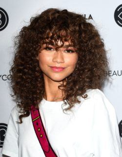 See how to style curly hair and bangs the A-list way