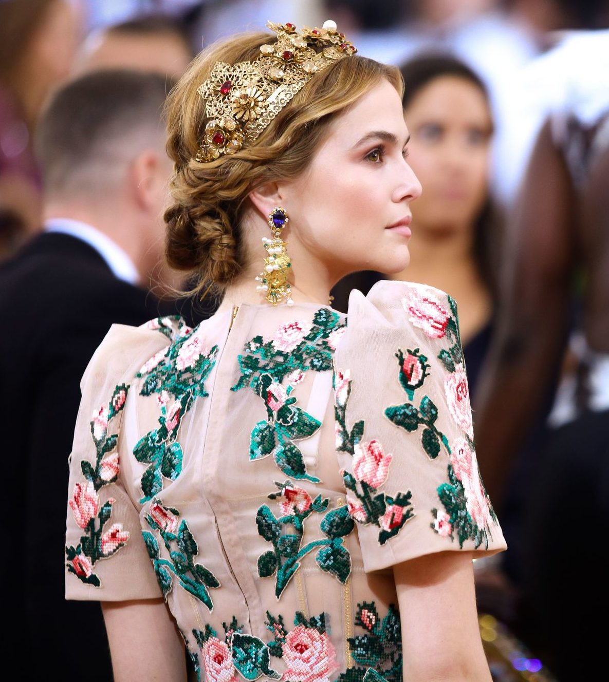zoey deutch with light brown hair in a braided hairstyle wearing a tiara at the MET gala