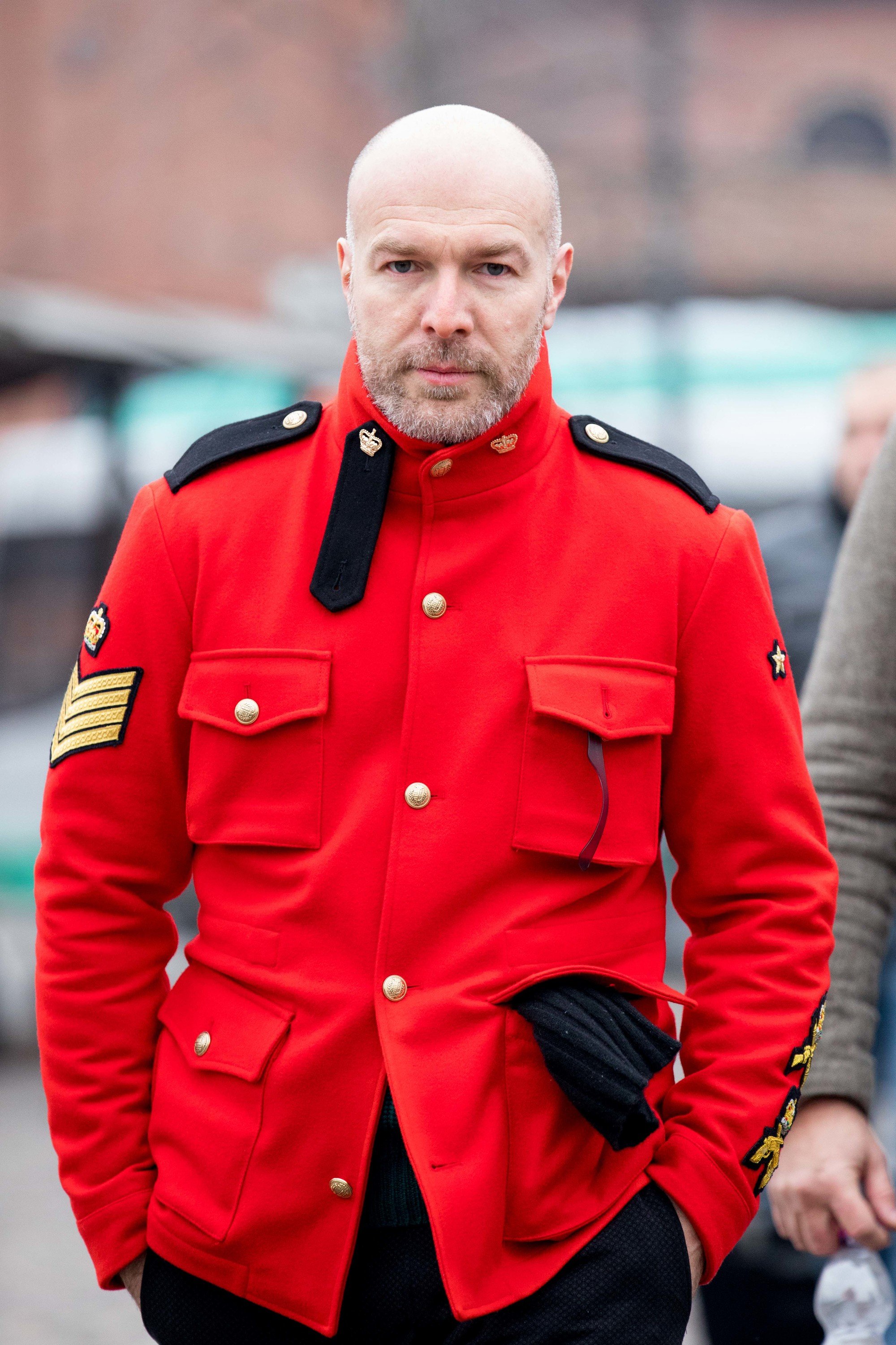 Man outside with bald hair