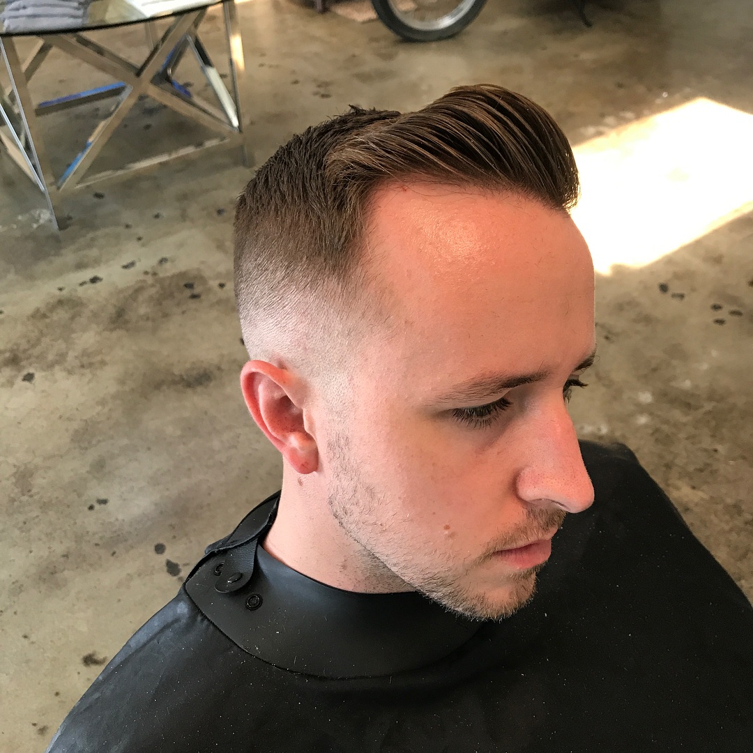 Bald hair man with slicked back hair