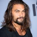 game of thrones actor jason momoa with long wild dark hair and heavy facial hair