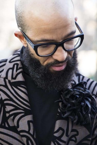 Bald man with beard and glasses