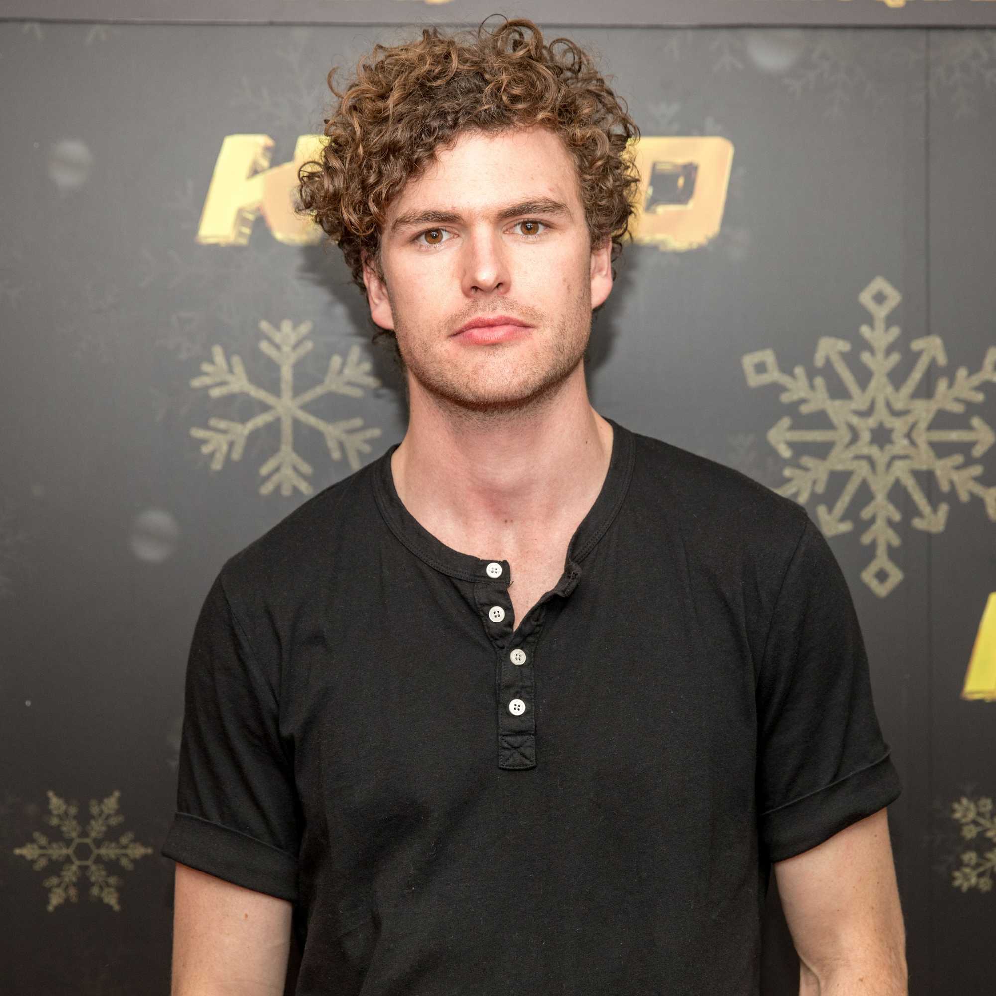 australian singer/songwriter vance joy with his short curly light brown hair