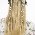 long braided blonde hair of a woman rear view