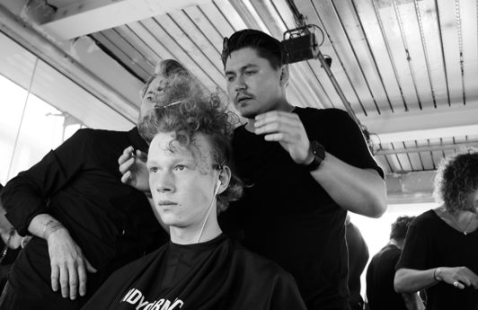 Male grooming: black and white pic of Kieron Webb Global Creative for Lynx and Axe styling hair