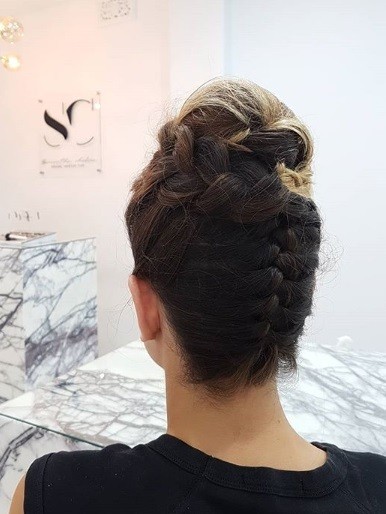 Wedding updos: Back view of a brunette with an upside down French braided updo