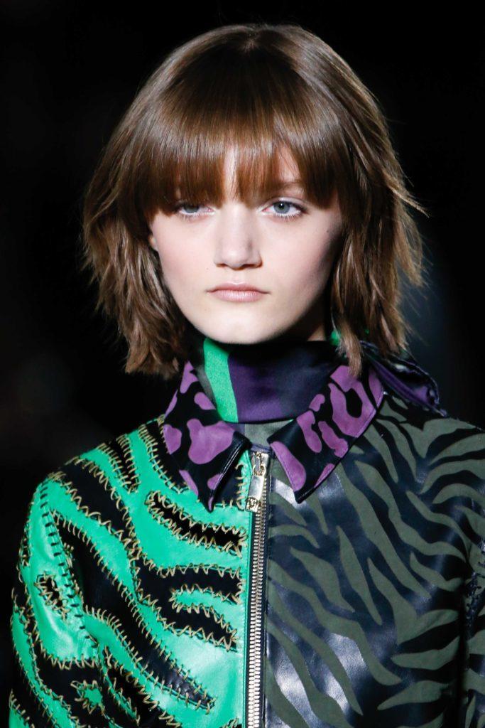 Brunette model with a choppy bob with bangs