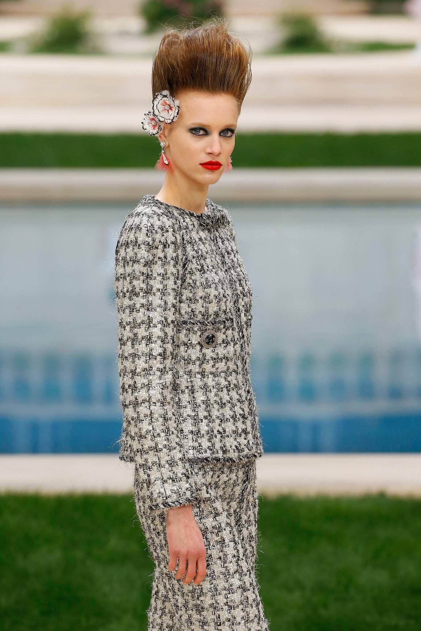 Haute Couture: Model at Chanel SS19 show with brown hair in high rockstar quiff.